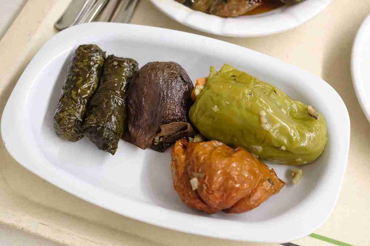 gallery-3 A gourmet platter of dolma, stuffed peppers, and eggplant, perfect for international cuisine lovers.